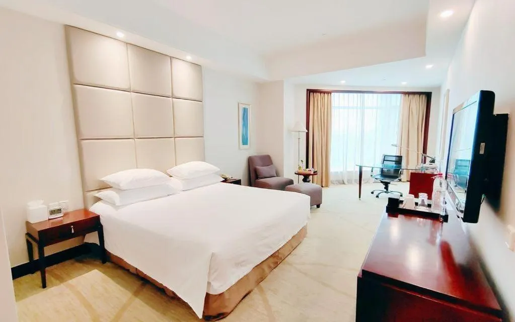 Bed in New Century Grand Hotel Zhuji Yaojiang