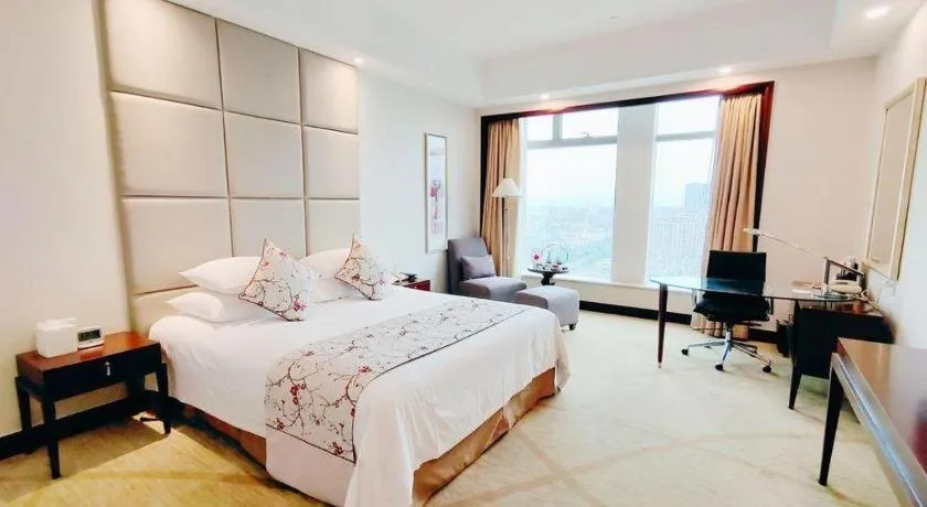 Bed in New Century Grand Hotel Zhuji Yaojiang