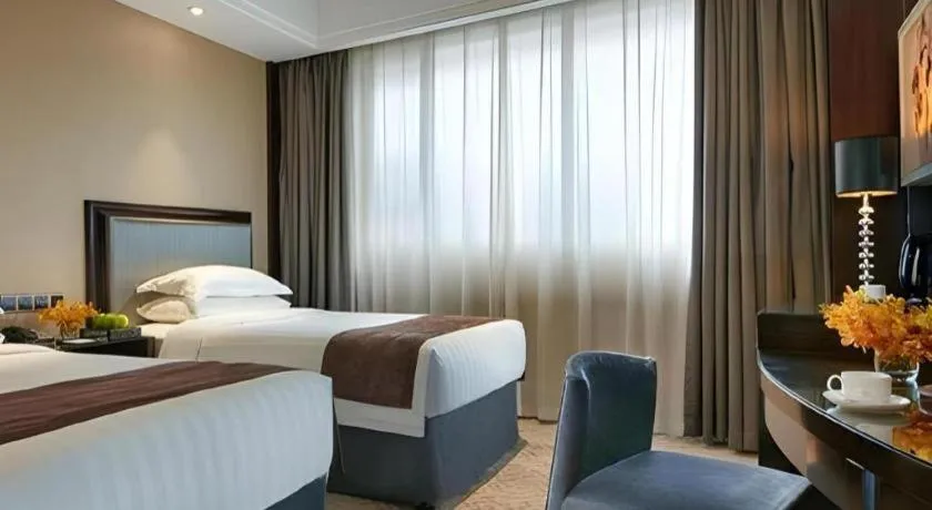 Bed in New Century Manju Hotel Shanghai New International Expo Center
