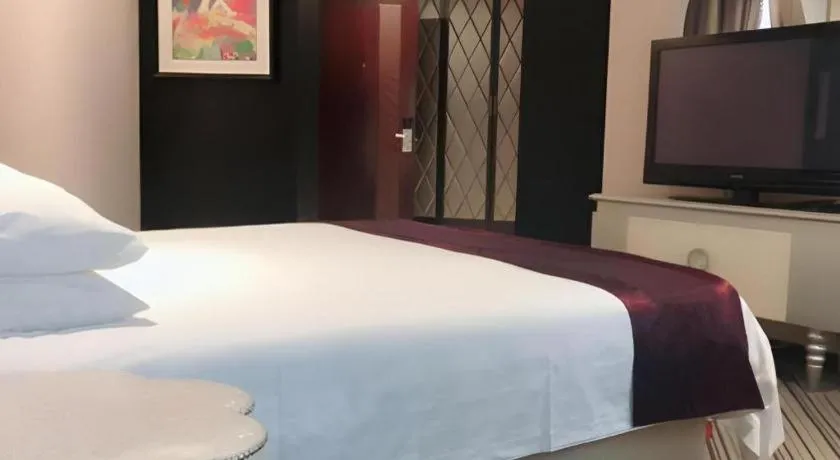 Bed in New Century Manju Hotel Shanghai New International Expo Center