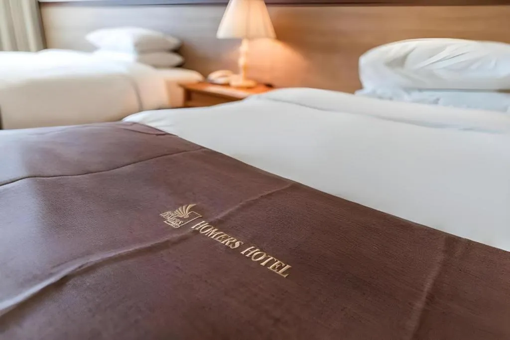 Bed in Hotel Homers