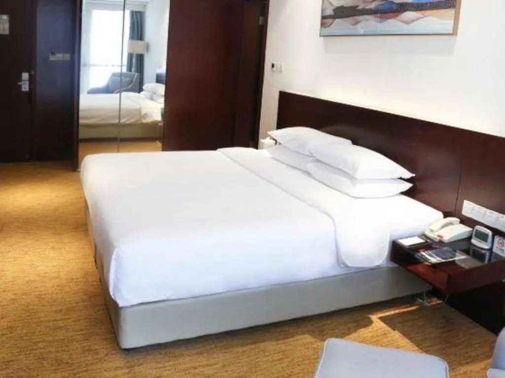 Bed in New Century Hotel Nanjing