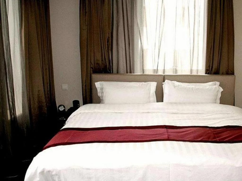 Bed in New Century Hotel Nanjing