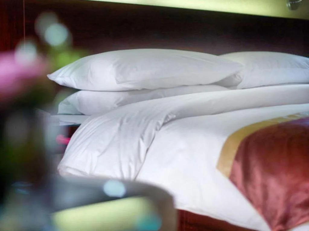 Bed in New Century Hotel Nanjing