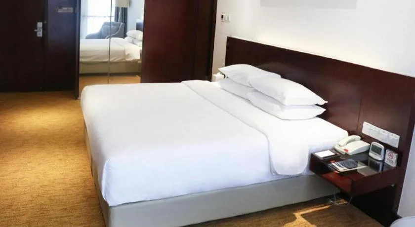 Bed in New Century Hotel Nanjing