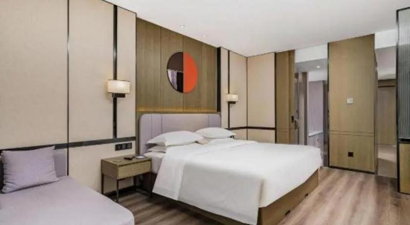 Bed in Zhong Yi Peng Ao Hotel