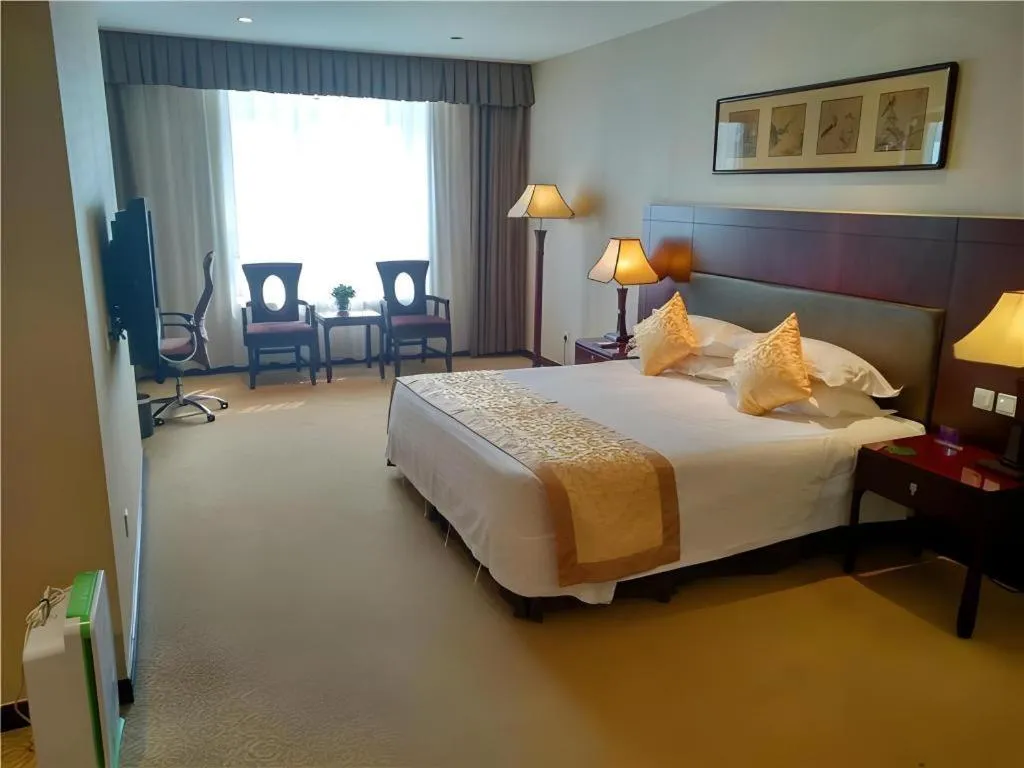 Bed in Zhong Yi Peng Ao Hotel