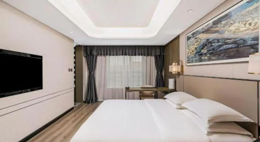 Bed in Zhong Yi Peng Ao Hotel