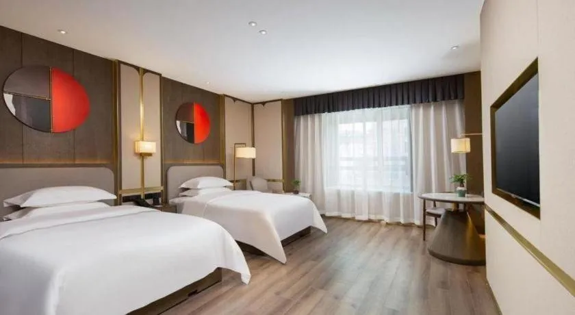 Bed in Zhong Yi Peng Ao Hotel