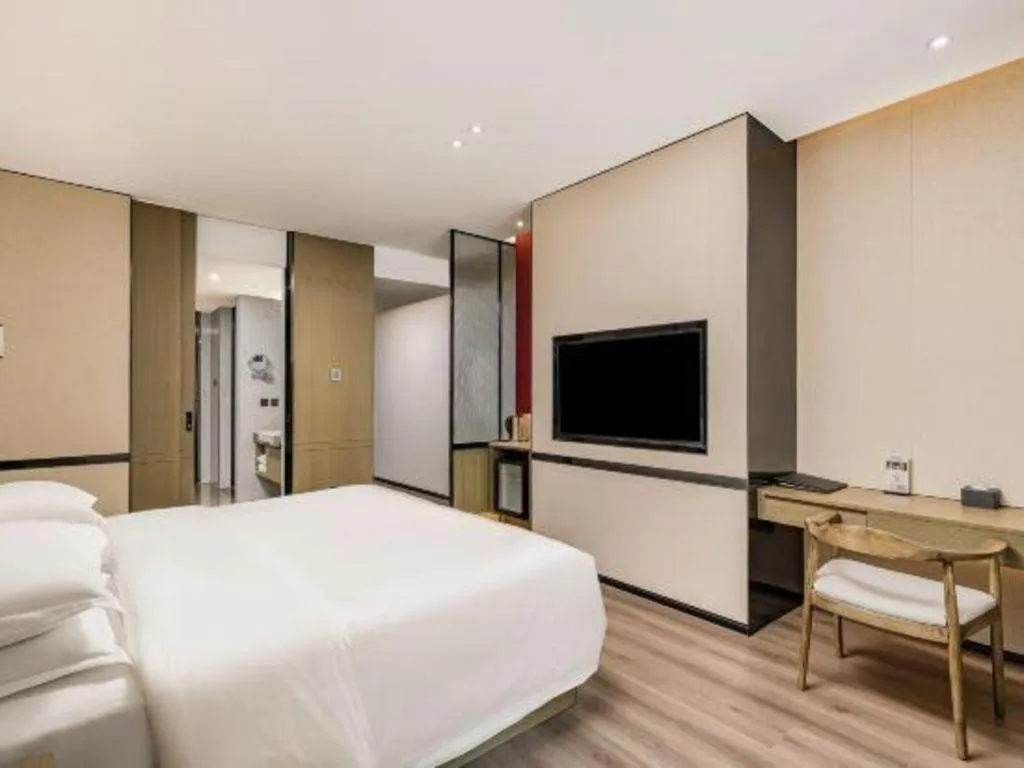 Bed in Zhong Yi Peng Ao Hotel