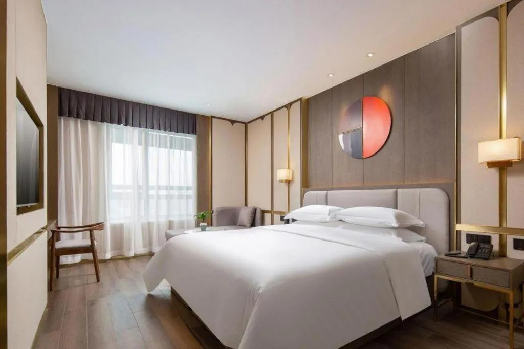 Bed in Zhong Yi Peng Ao Hotel