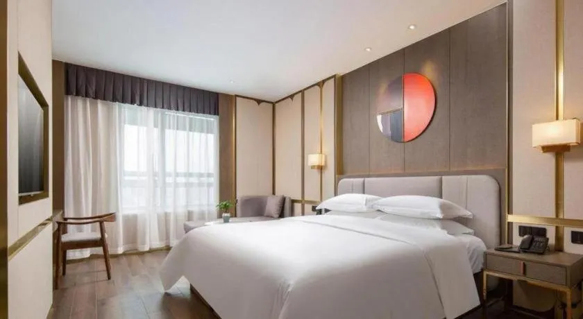 Bed in Zhong Yi Peng Ao Hotel