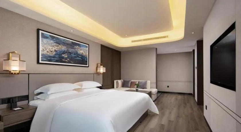 Bed in Zhong Yi Peng Ao Hotel