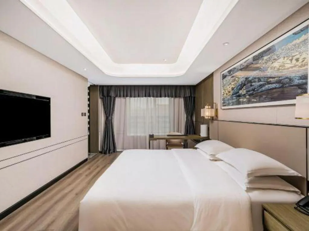 Bed in Zhong Yi Peng Ao Hotel