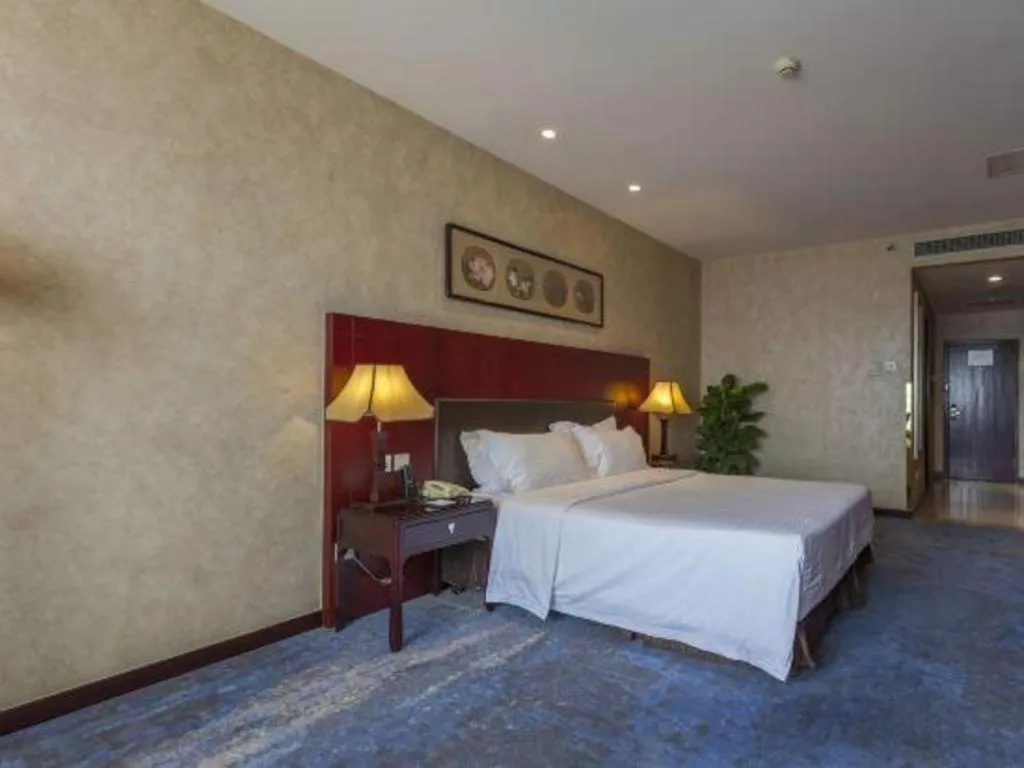 Bed in Zhong Yi Peng Ao Hotel