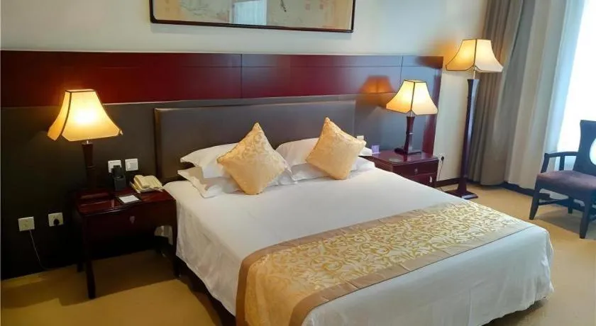 Bed in Zhong Yi Peng Ao Hotel