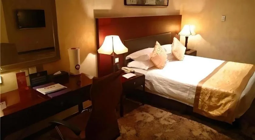 Bed in Zhong Yi Peng Ao Hotel