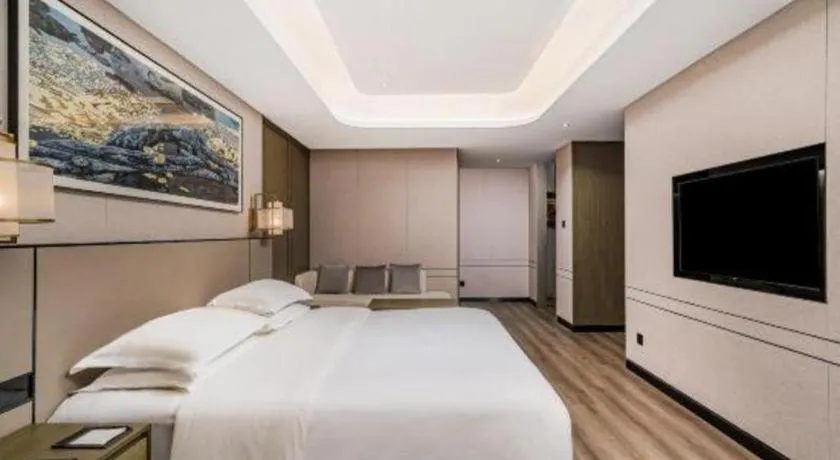 Bed in Zhong Yi Peng Ao Hotel