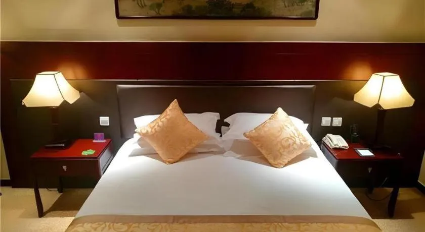 Bed in Zhong Yi Peng Ao Hotel