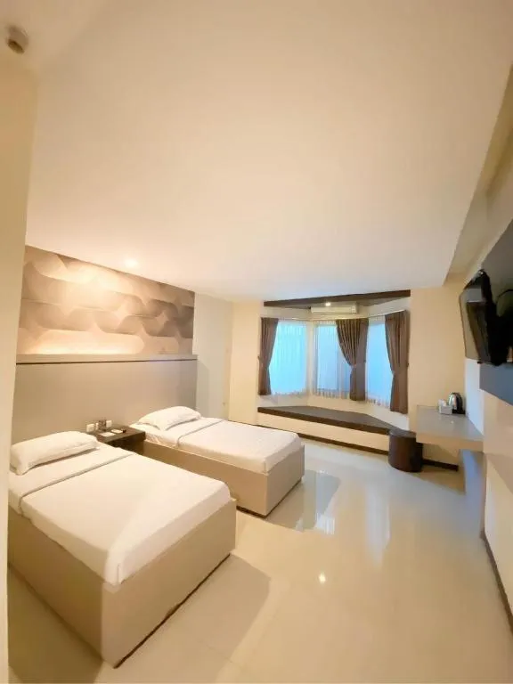 Bed in Alexander Hotel Tegal