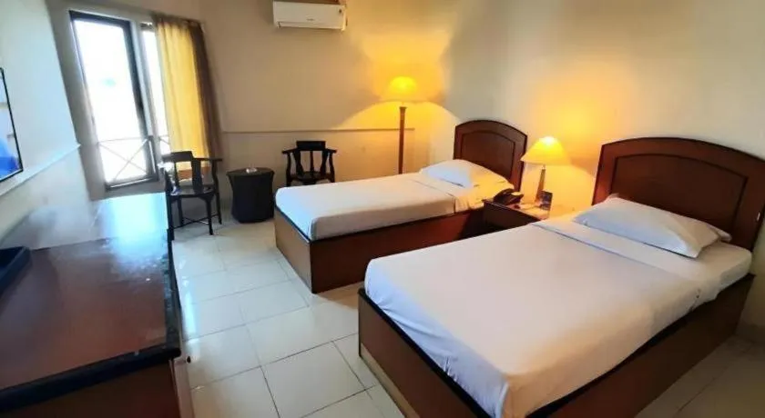 Bed in Alexander Hotel Tegal