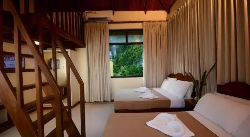 Bed in Ipil Suites El Nido