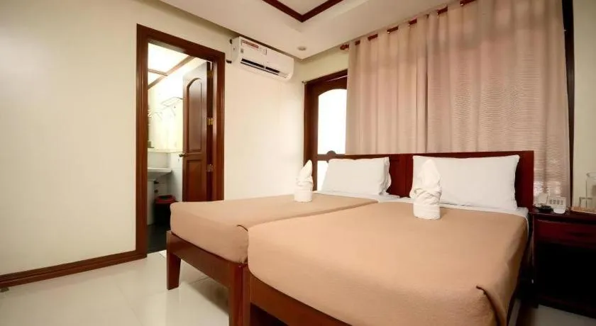 Bed in Ipil Suites El Nido