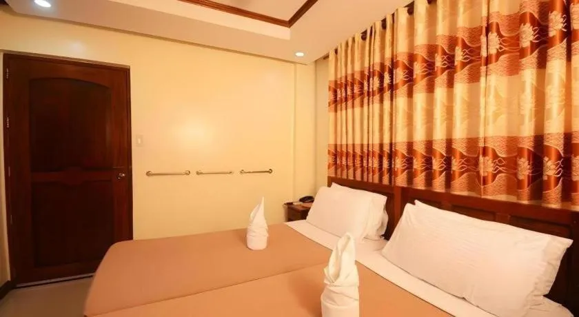 Bed in Ipil Suites El Nido