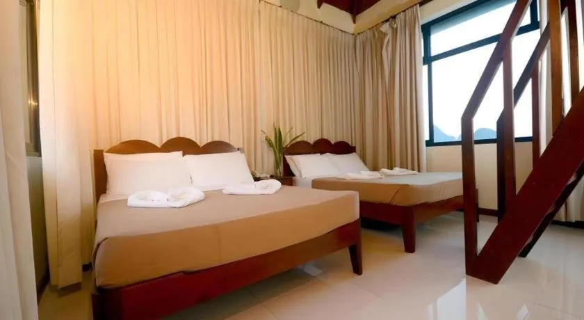 Bed in Ipil Suites El Nido