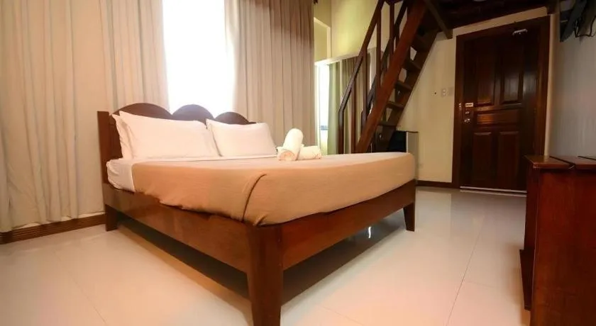 Bed in Ipil Suites El Nido