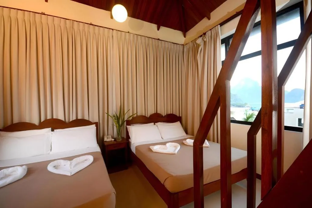 Bed in Ipil Suites El Nido