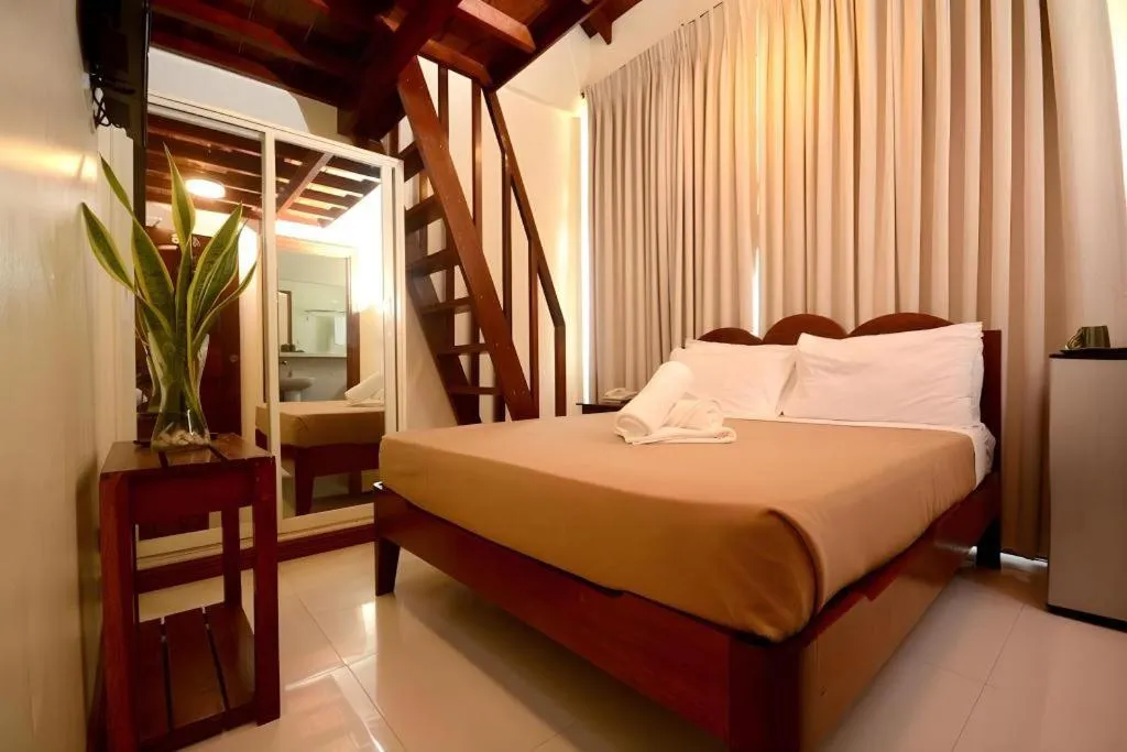Bed in Ipil Suites El Nido