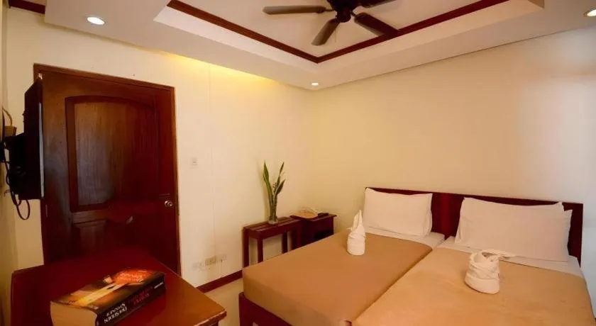 Bed in Ipil Suites El Nido
