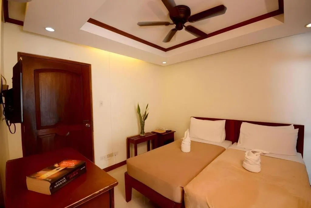 Bed in Ipil Suites El Nido