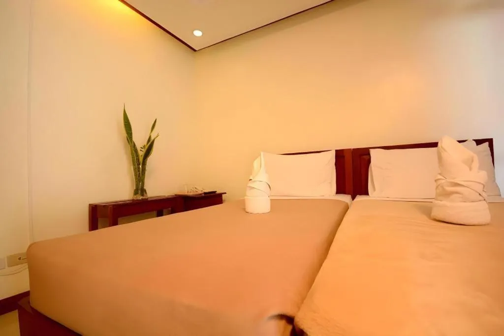 Bed in Ipil Suites El Nido