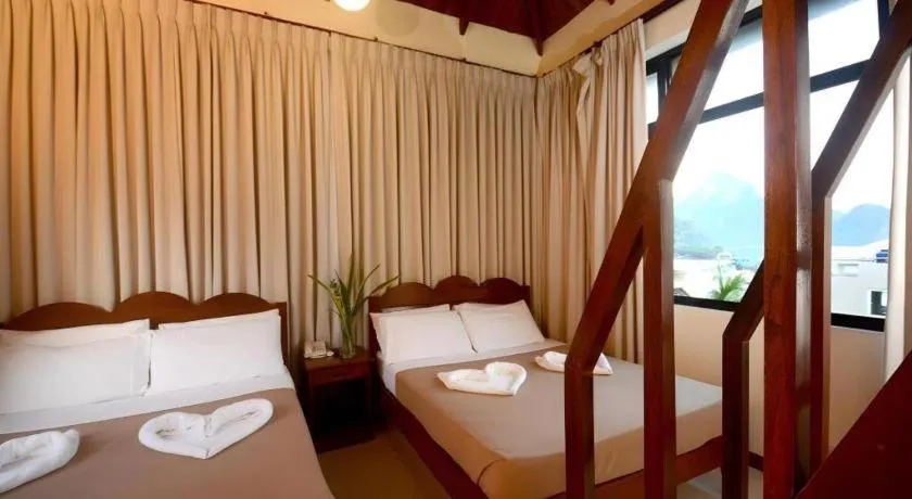 Bed in Ipil Suites El Nido