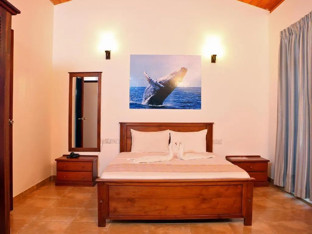 Bed in OYO 246 Roy Villa Beach Hotel