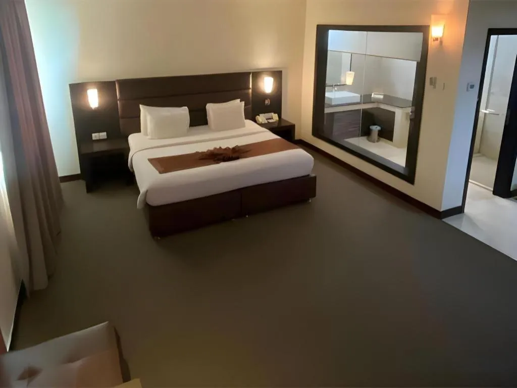 Bed in The BCC Hotel & Residence