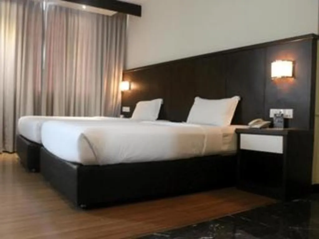 Bed in The BCC Hotel & Residence