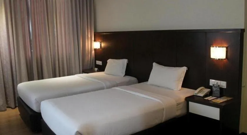 Bed in The BCC Hotel & Residence