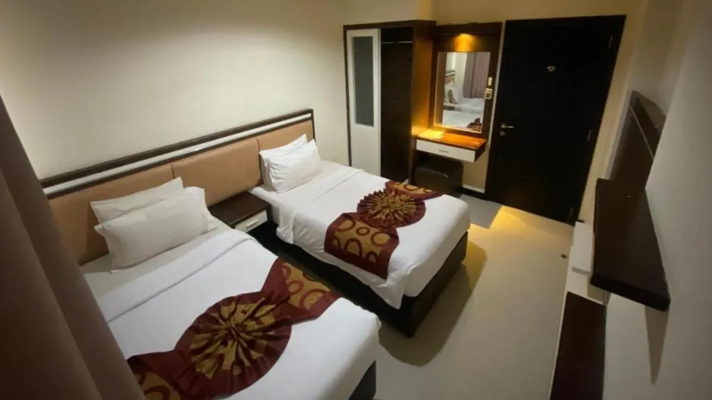 Bed in The BCC Hotel & Residence