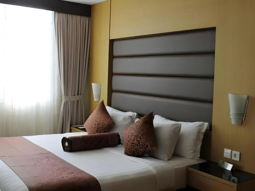 Bed in The BCC Hotel & Residence