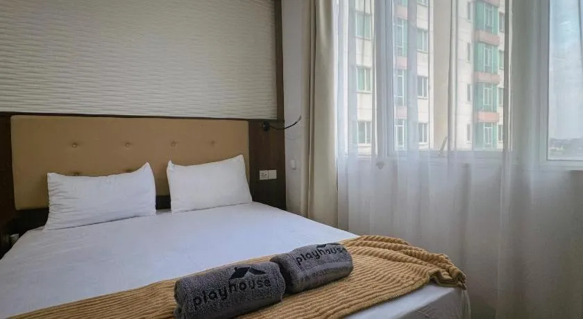 Bed in The BCC Hotel & Residence