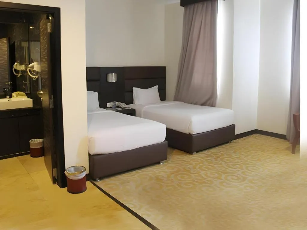 Bed in The BCC Hotel & Residence