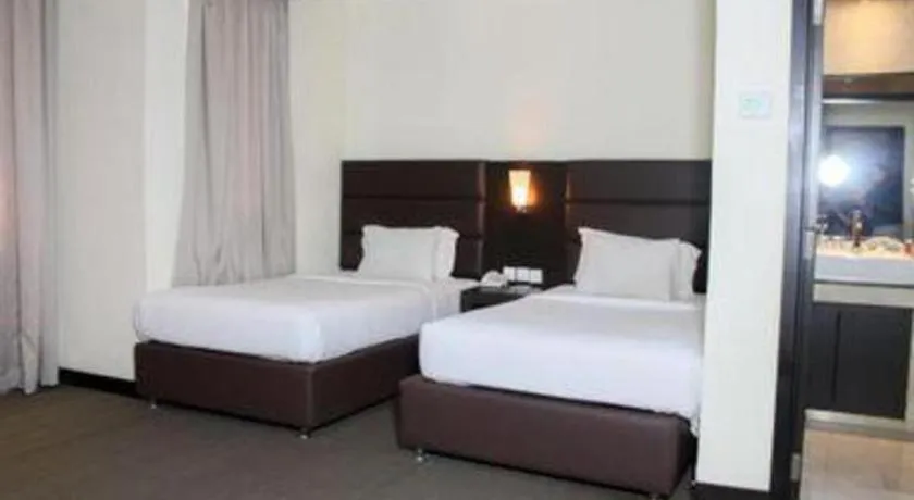 Bed in The BCC Hotel & Residence