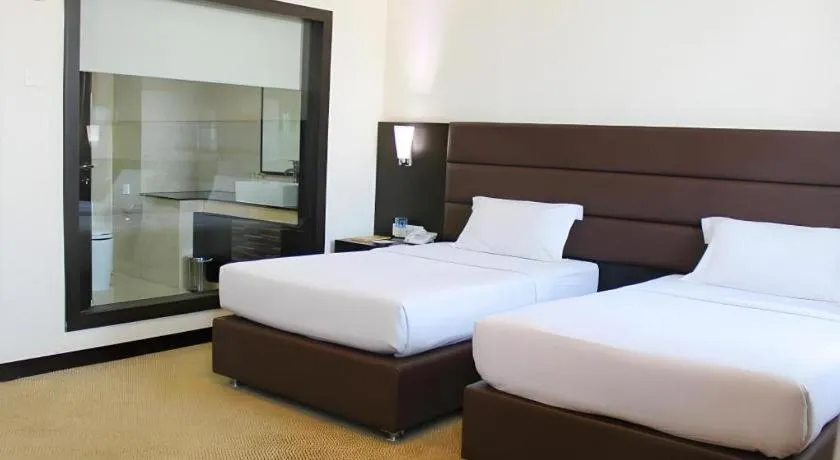 Bed in The BCC Hotel & Residence
