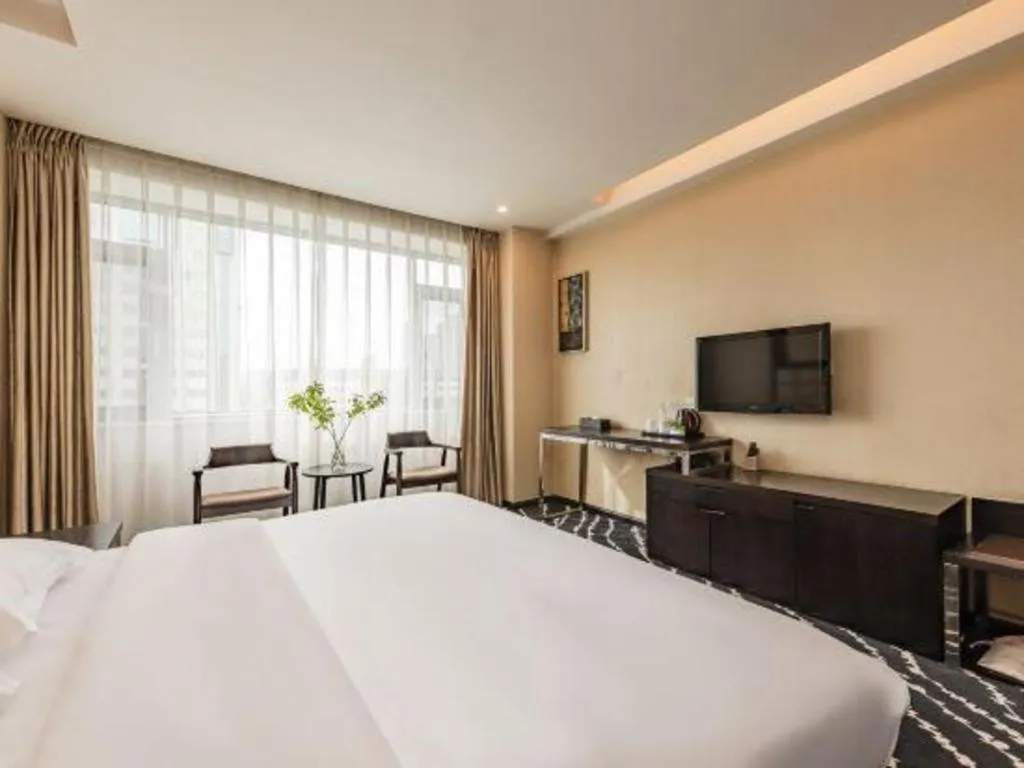 Bed in Kunming Long Way Hotel