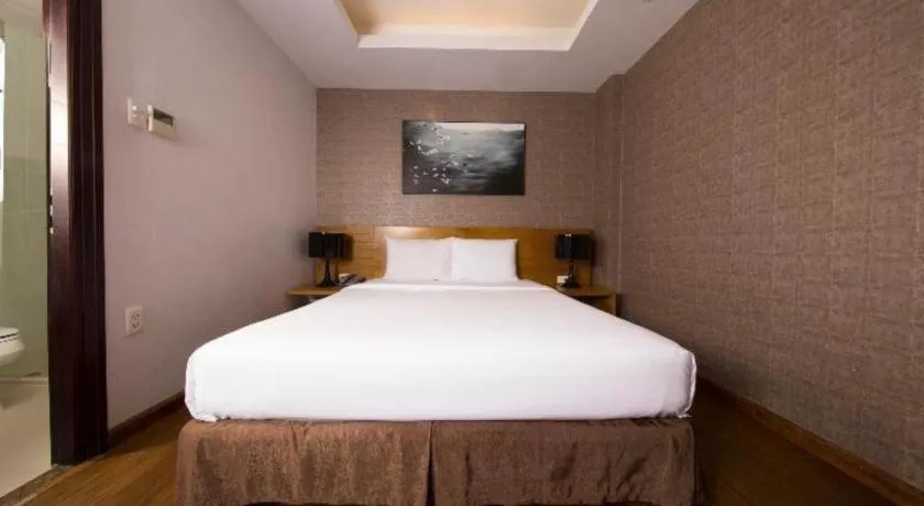 Bed in AHA Boutique Ben Thanh Hotel