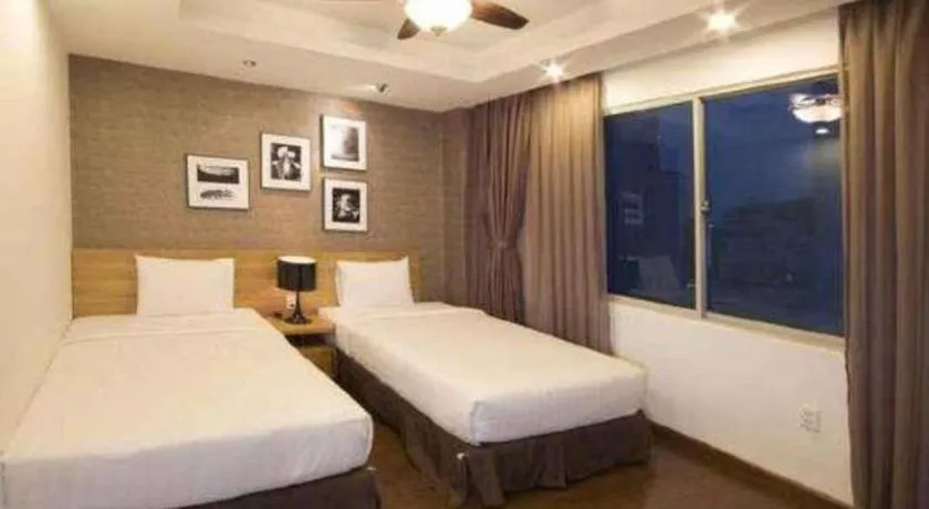 Bed in AHA Boutique Ben Thanh Hotel