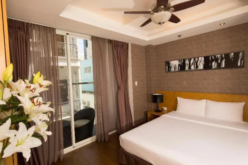 Bed in AHA Boutique Ben Thanh Hotel